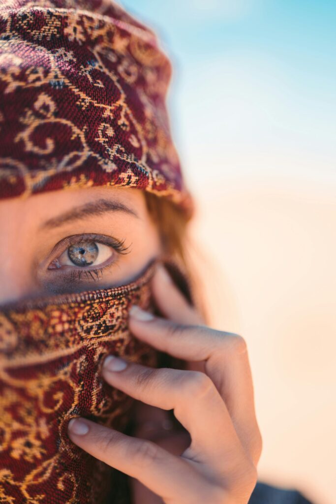 first wrapped her hair to prevent sand, then turned it into a mask